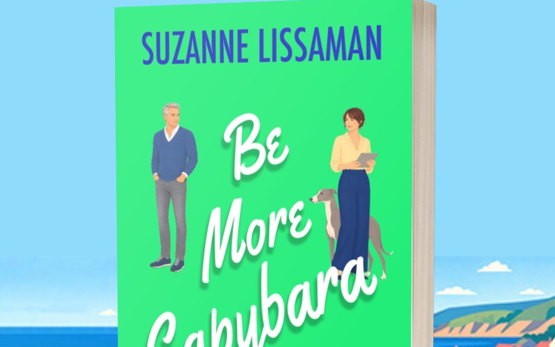 Mockup of rom com Be More Capybara paperback on a seaside image with preorder information for 11 August 2026 shown above
